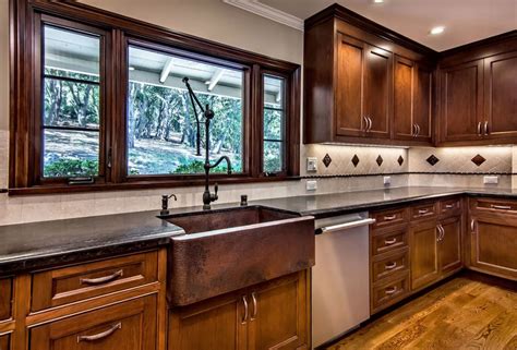 dark cabinets white counters stainless steel appliances with copper sink|black kitchen with dark cabinets.